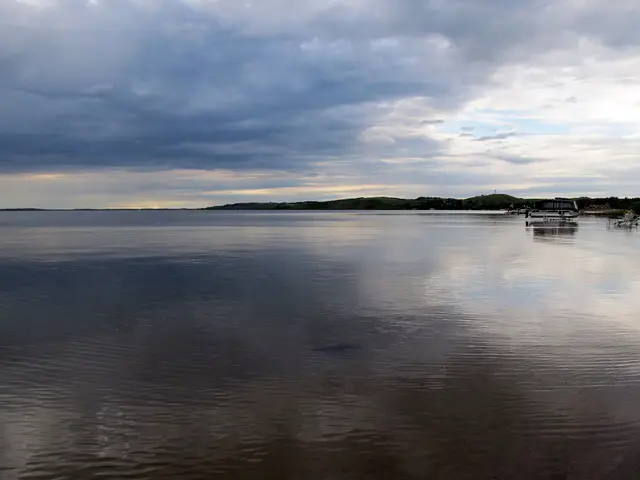 Calm water on the lake at dusk